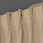 Close-up of beige pinch-pleat curtains showing the detailed stitching and fabric texture (1)